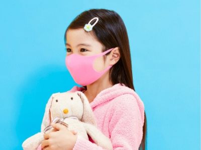 Girl wearing a pink Pitta Mask